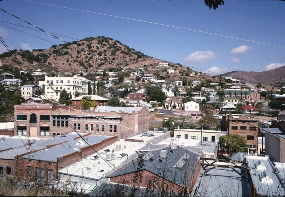 Old Bisbee's brick buildings and hillside houses below the Mule Mountains