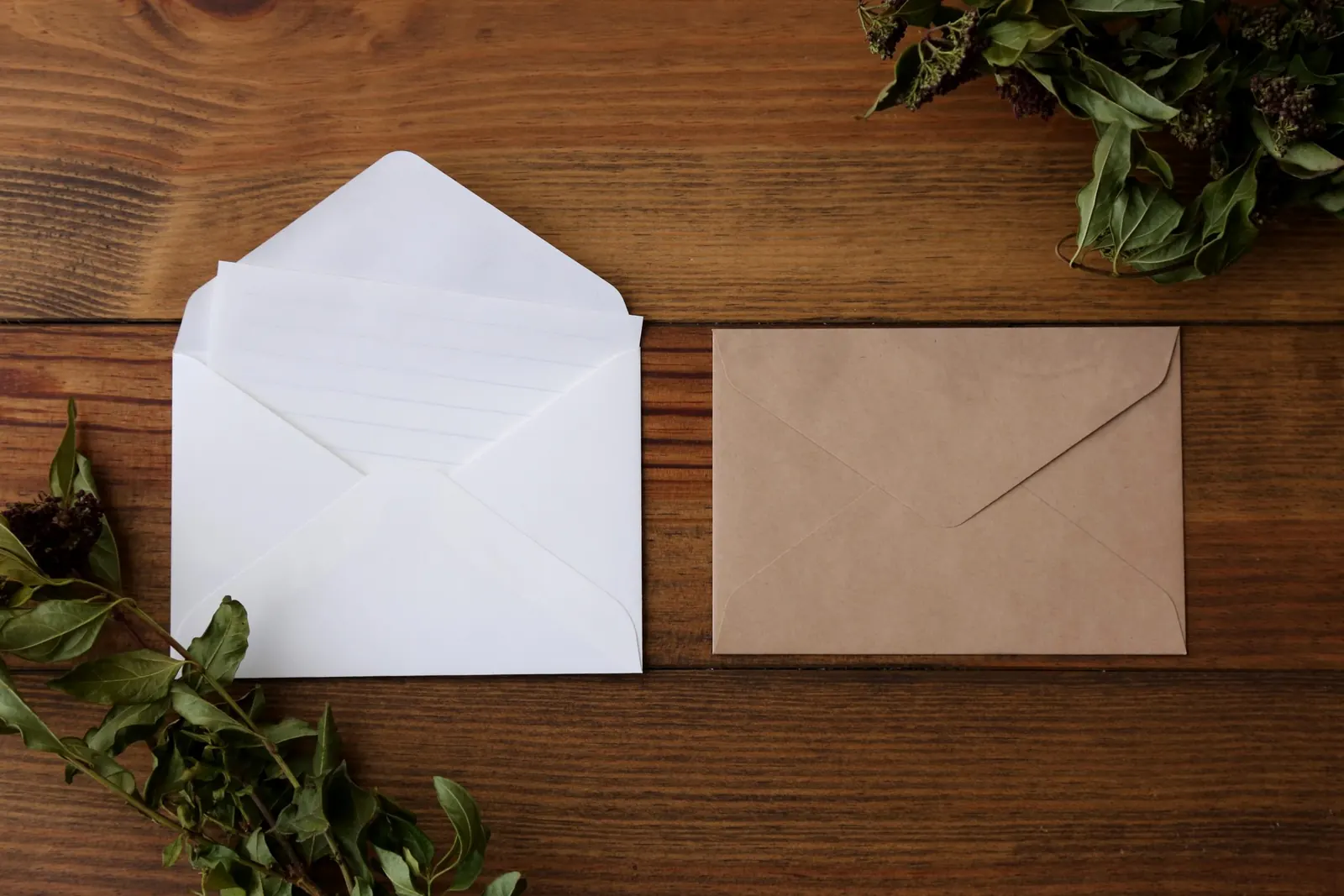 Blank envelopes on a wooden table, ready for mail art
